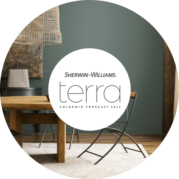Sherwin-Williams Terra Colormix Forecast 2023 with a modern table and gray-green walls.